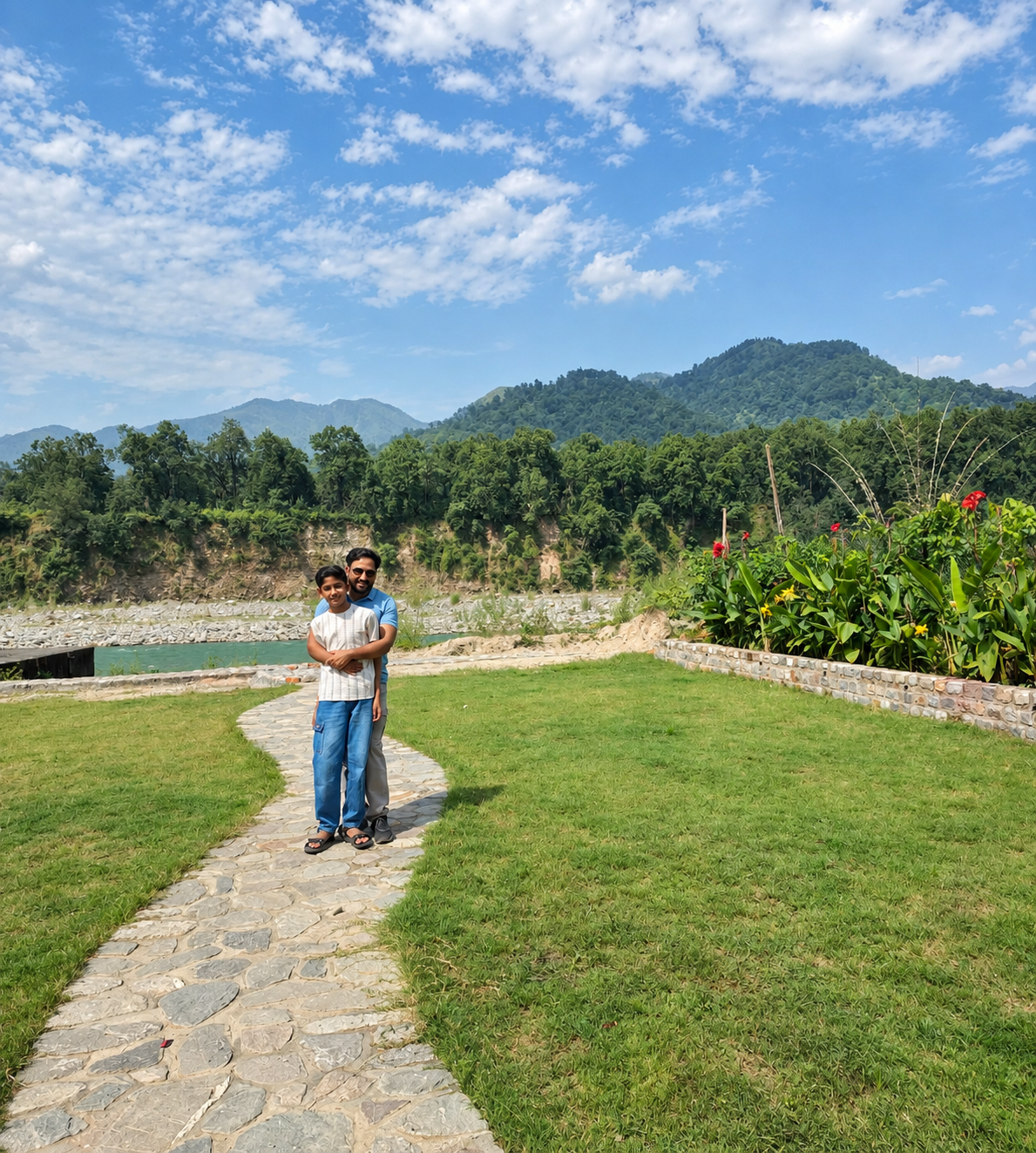 Riverside garden pathway at Heaven River Retreat, Jim Corbett — lush tropical gardens leading to the river in Kunkhet, Uttarakhand